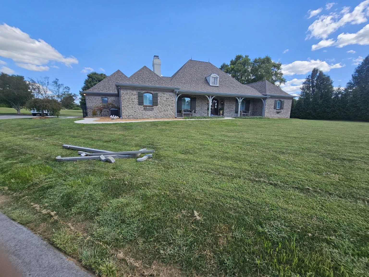 Full home gutter installation project on a stone house
